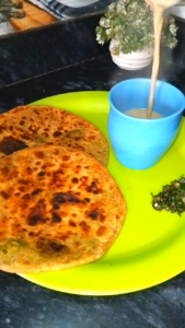 Matar Paratha Served with Tea Indian Breakfast