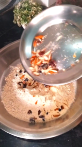 Mixing Dry Fruits in Atta for Biscuits