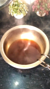 Preparing Jaggery Water for Atta Biscuits