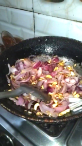 Cooked Onion and Spice Mixture Cooling Before Blending