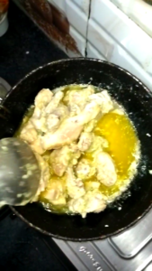 Marinated Chicken Being Fried in a Pan for White Chicken Recipe
