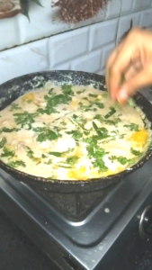 Green Chilies and Fresh Coriander Added to White Chicken
