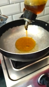 Heating Mustard Oil for Home Style Ridge Gourd Recipe
