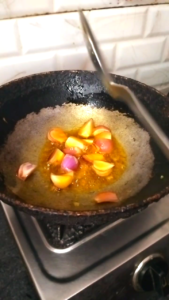 Onions being fried until soft for Dhaba Style Matar Paneer Recipe