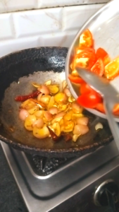 Tomatoes Added and Cooked with Spices for Matar Paneer Gravy