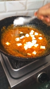 Paneer Cubes and Salt Added to Cooked Masala for Matar Paneer