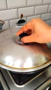 Covering Bhindi with Lid to Cook
