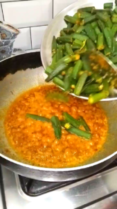 Adding Fried Bhindi to Masala