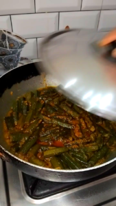 Adding Coriander and Covering Dahi Bhindi